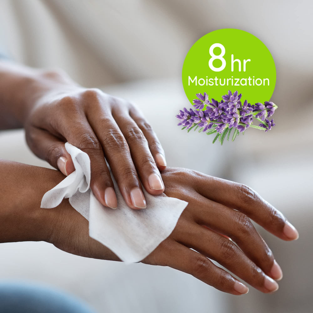 Wet Ones wipe held by hand for scale showing portable 20-count size