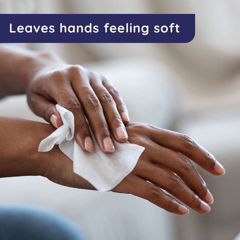 Hand using Wet Ones wipe to remove mess for quick refresh