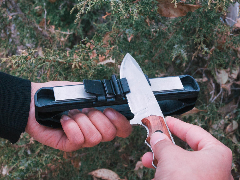 Wicked Edge Venture in use at camp sharpening a folding knife for convenience