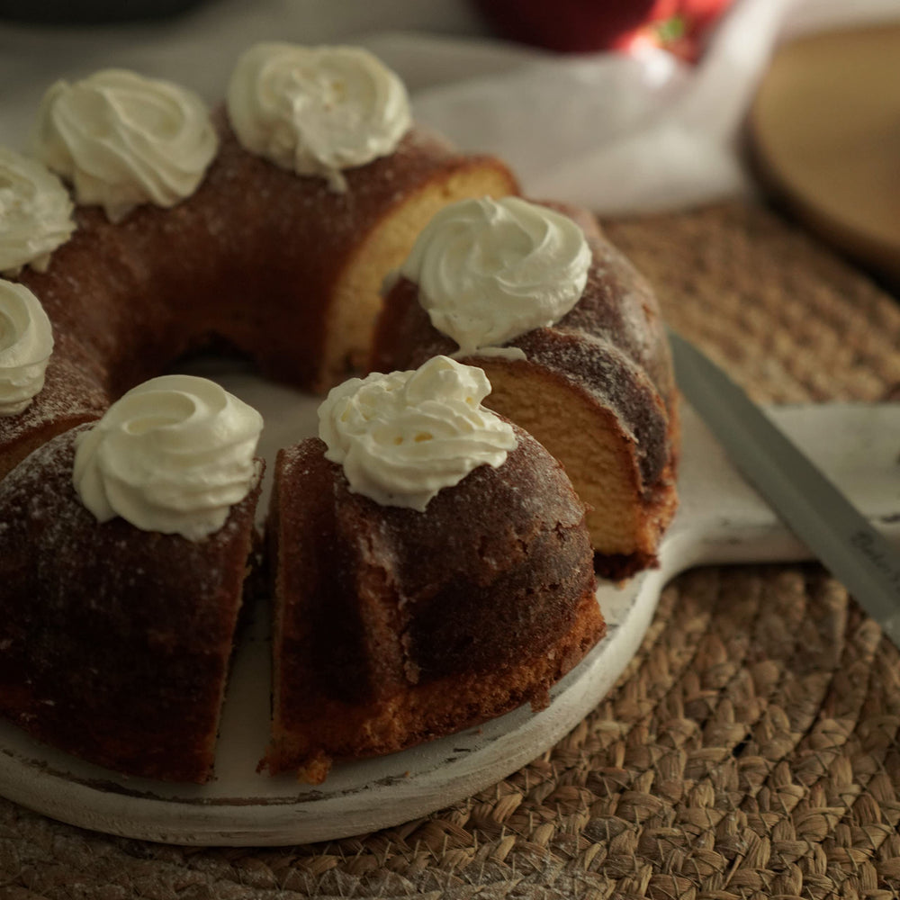 Wilton fluted tube pan with finished pound cake showing decorative edges and effortless release