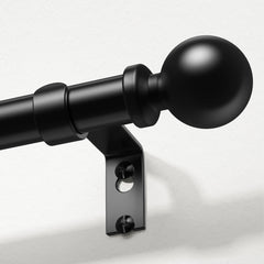 Wolistsa front view of black curtain rod with finials showing clean silhouette and modern look