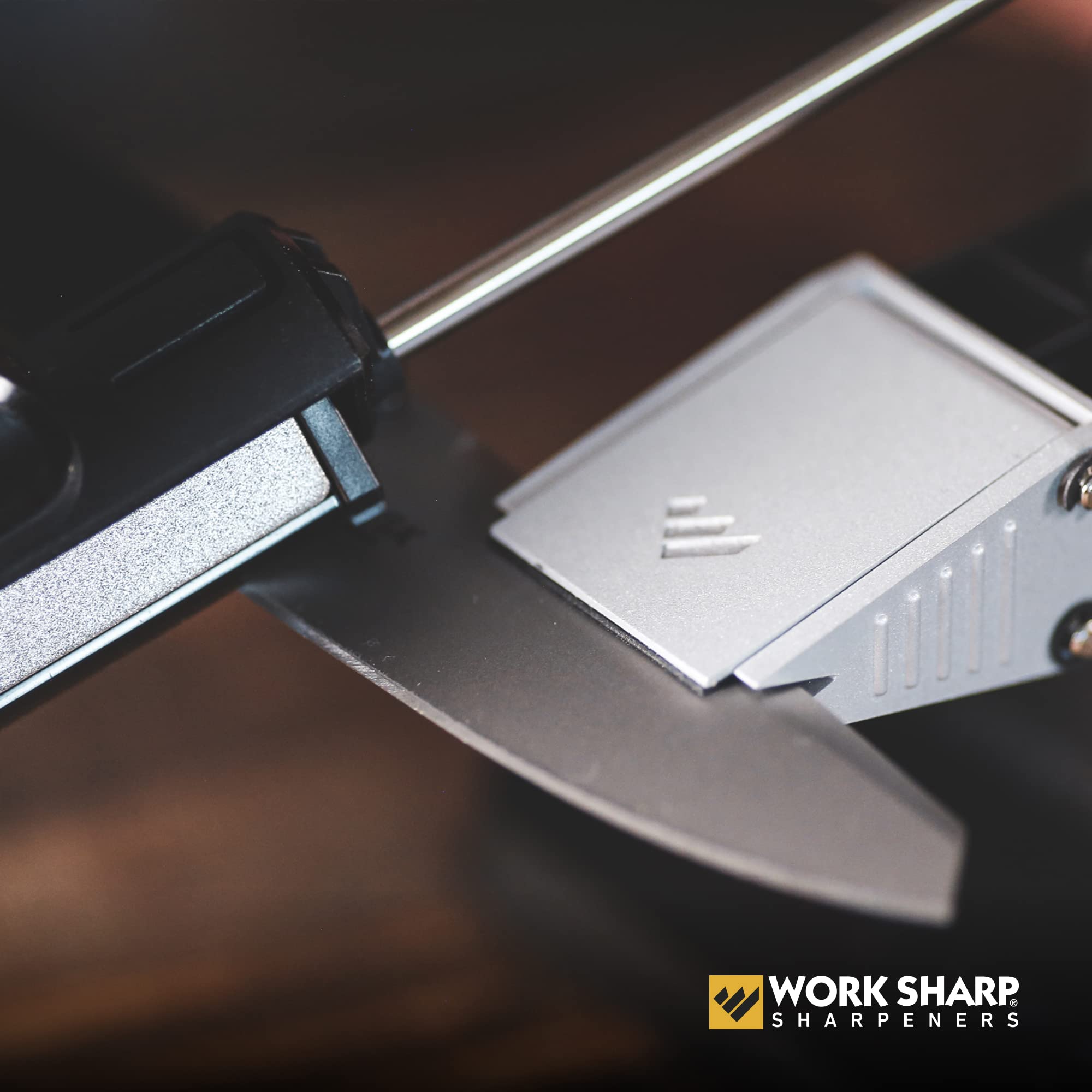 WORK SHARP sharpener next to common knife for scale to show compact workshop footprint