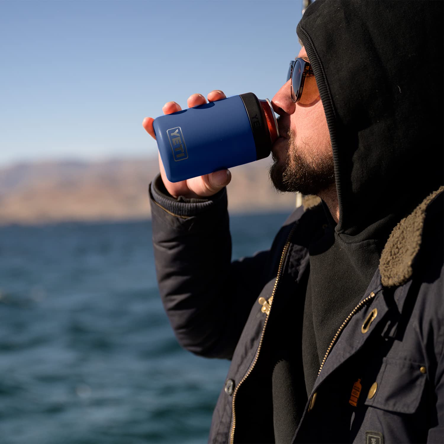 YETI Rambler Colster in an outdoor setting showing rugged use and cold retention