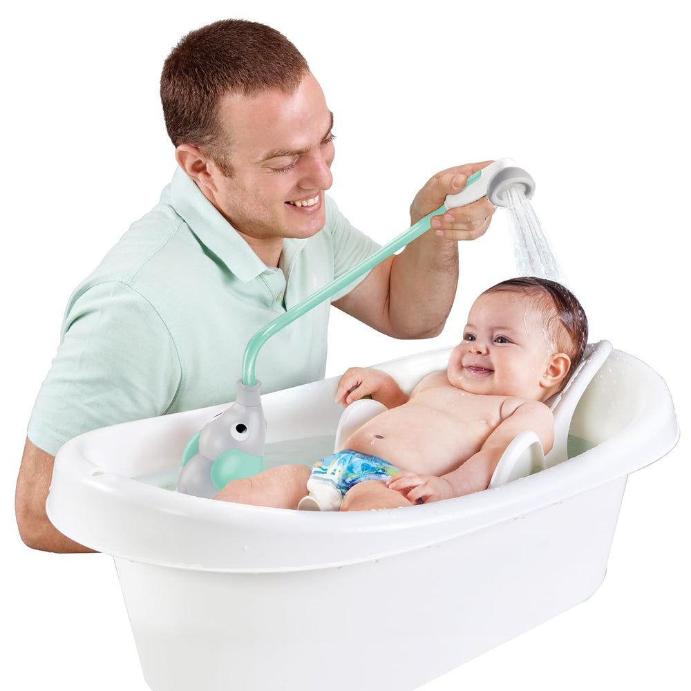 Yookidoo in sink being used one-handed to rinse baby with confidence