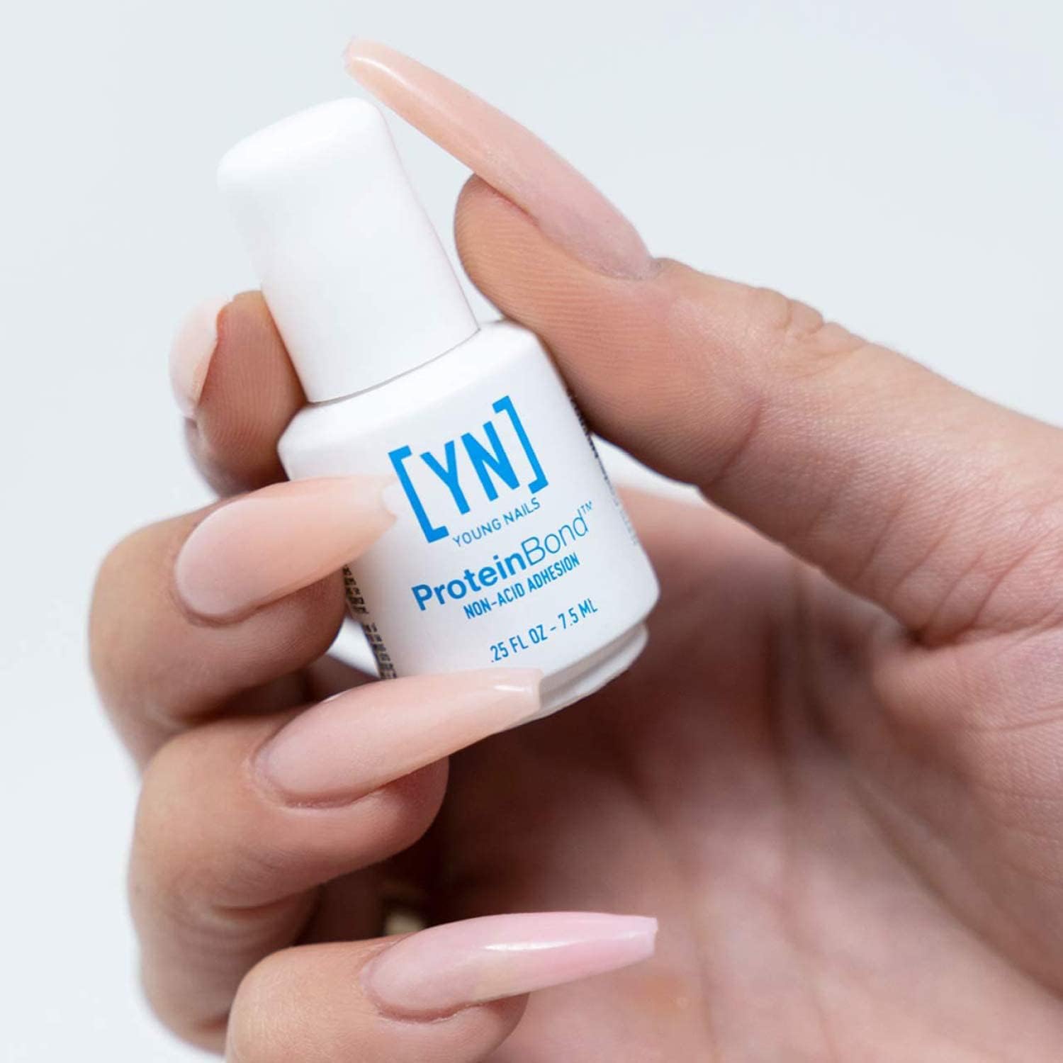 Young Nails product dispense close-up showing liquid texture and control