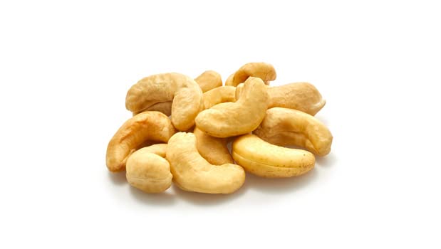 Yupik cashews beside blender for making creamy dairy-free sauces