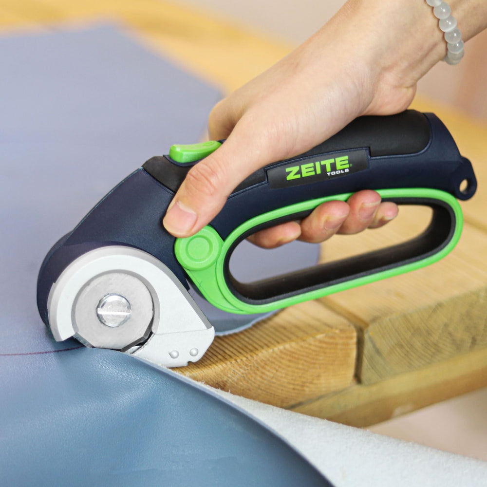 ZEITE cutter held in hand to show scale and lightweight portability for extended tasks