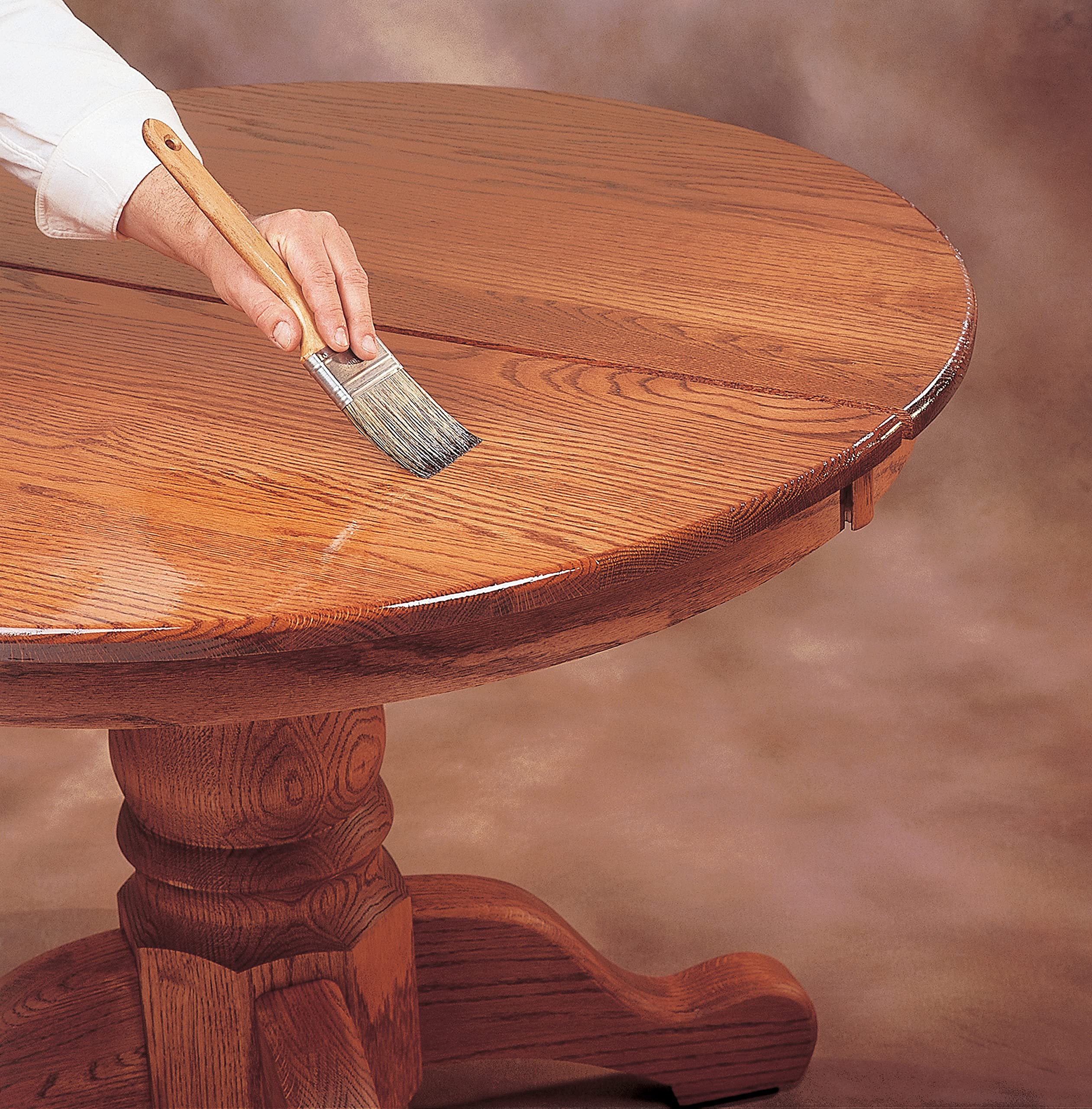 Zinsser being brushed onto wood demonstrating smooth coverage and adhesion benefit