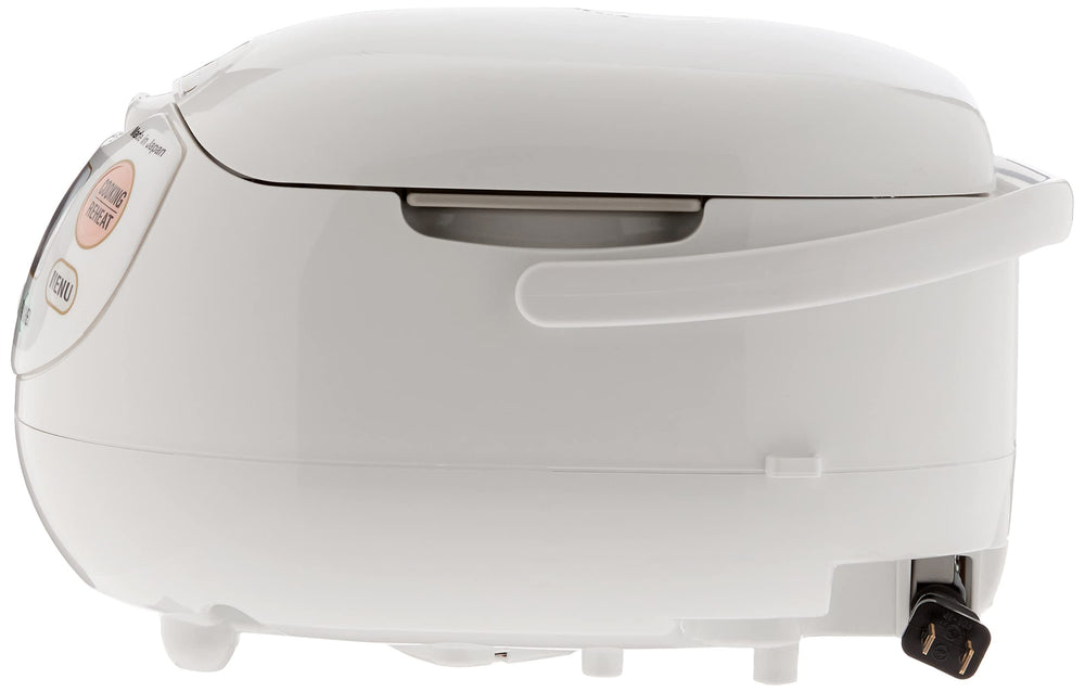 Zojirushi rice cooker with bowl of cooked rice in kitchen setting for consistent results
